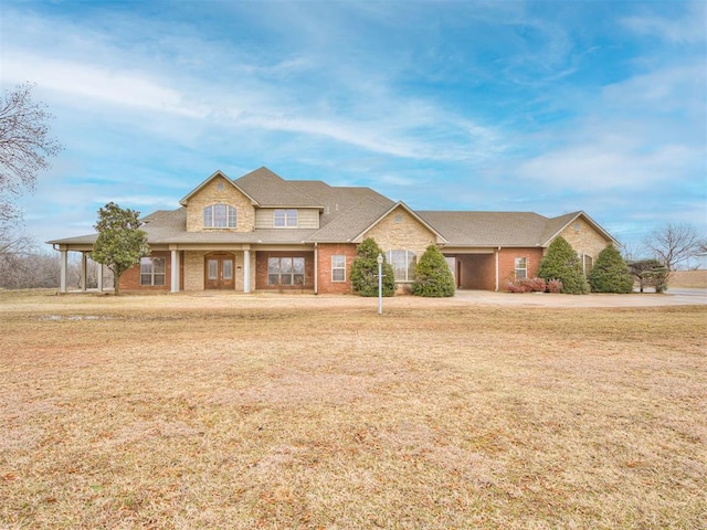 1419 W Royal Oaks Rd, Pauls Valley, OK 73075 - view of front of property with a front lawn, roof with shingles, and brick siding