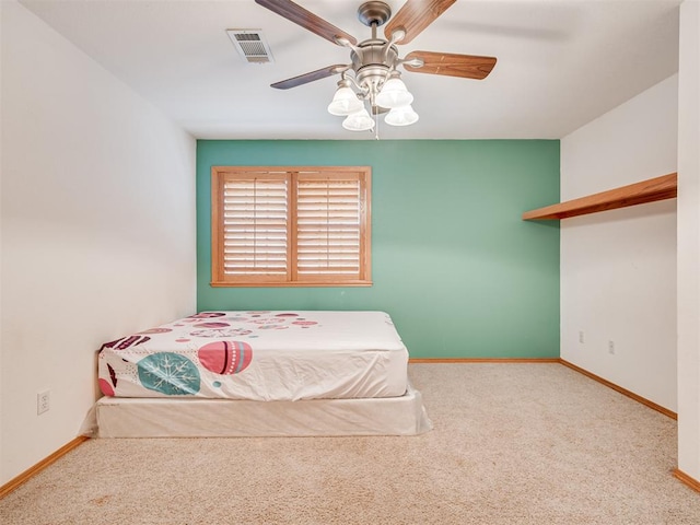 unfurnished bedroom with carpet flooring and ceiling fan