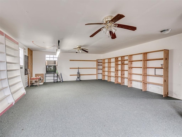 interior space with carpet flooring and ceiling fan