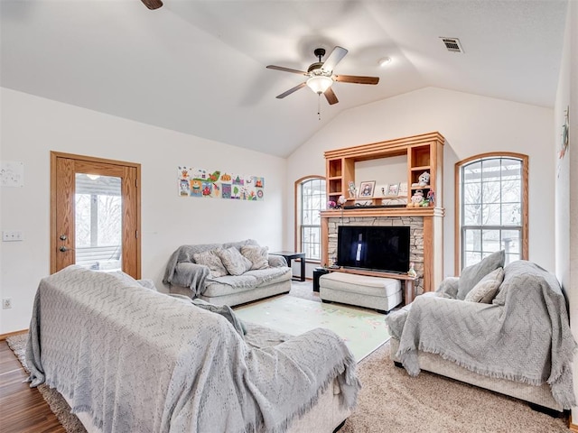 living room featuring a wealth of natural light, hardwood / wood-style floors, and ceiling fan