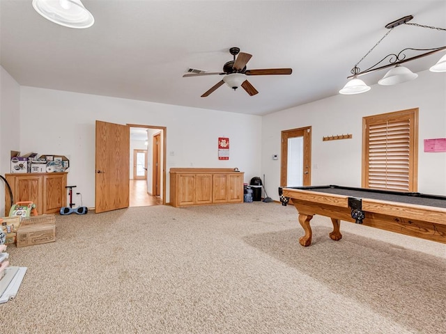 game room featuring light carpet, ceiling fan, a healthy amount of sunlight, and pool table