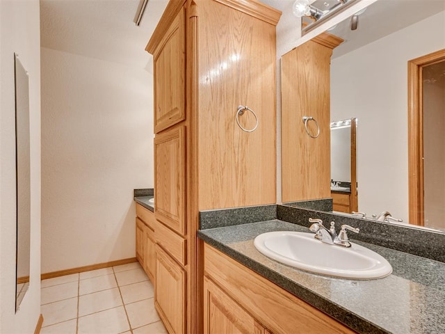 bathroom with tile patterned floors and vanity