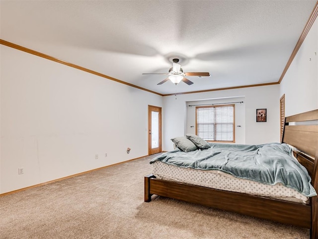 carpeted bedroom featuring a textured ceiling, ceiling fan, and ornamental molding