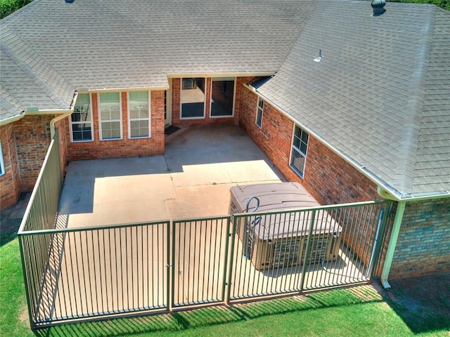 back of property with a patio