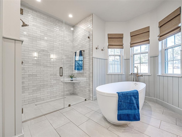 bathroom featuring tile patterned floors and plus walk in shower