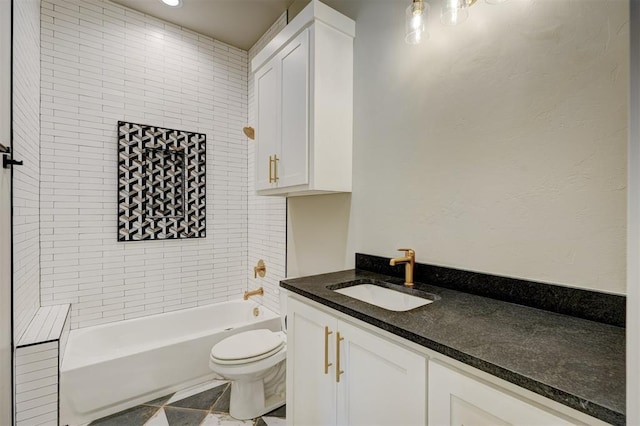 full bathroom with vanity, toilet, and tiled shower / bath