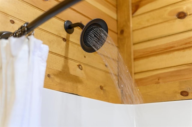 room details featuring wood walls