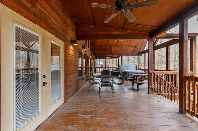 sunroom featuring ceiling fan, wood ceiling, and vaulted ceiling