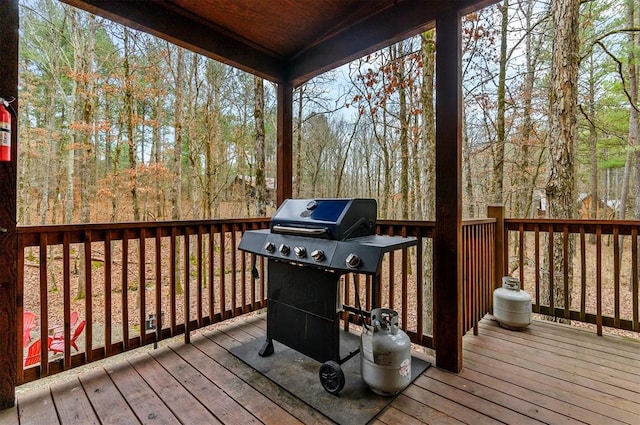 wooden terrace with area for grilling