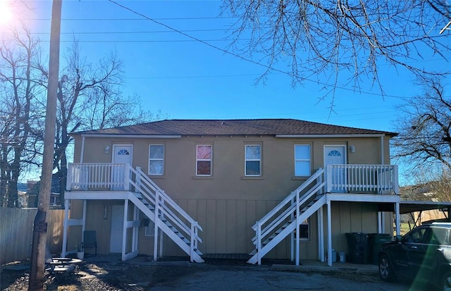 back of property featuring a carport