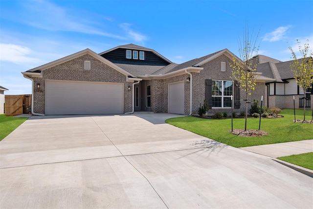 view of front of property with a garage and a front lawn