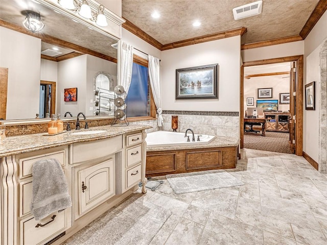 bathroom with a washtub, vanity, and ornamental molding