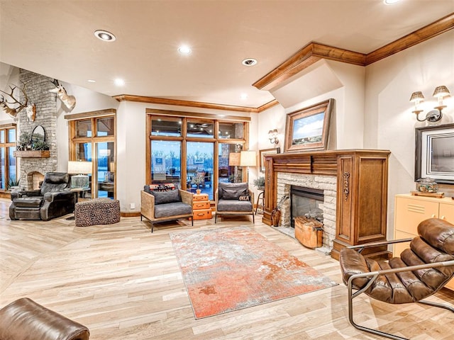 living room with a stone fireplace, crown molding, and light hardwood / wood-style flooring