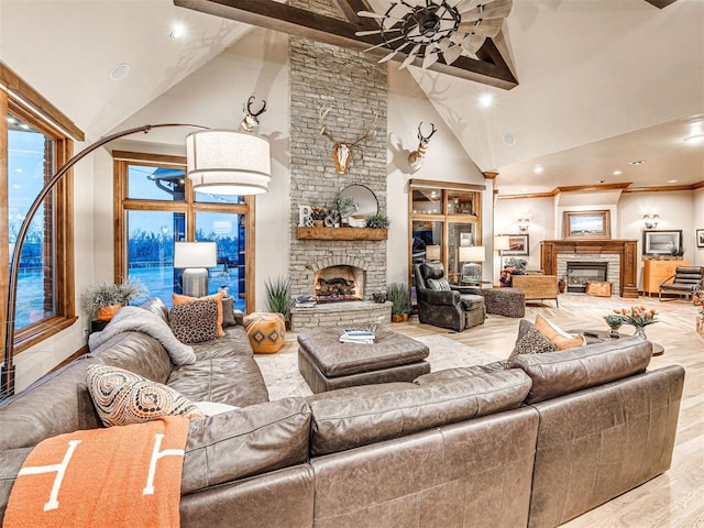 living room with beamed ceiling, light wood-type flooring, a fireplace, and high vaulted ceiling