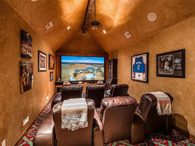 carpeted home theater room featuring vaulted ceiling with beams