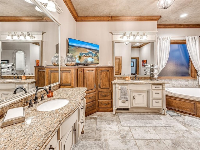 bathroom with a bathing tub, vanity, and crown molding