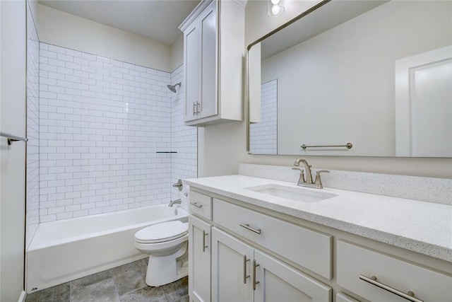 full bathroom featuring toilet, vanity, and tiled shower / bath combo