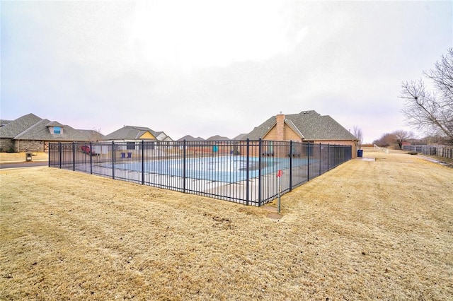 view of swimming pool with a yard and a patio area