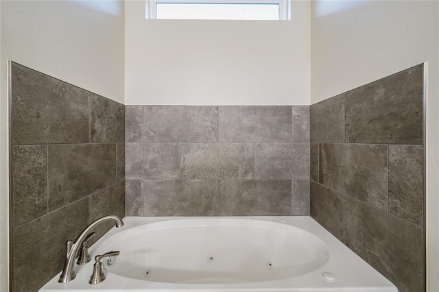 bathroom featuring a tub to relax in