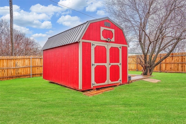 view of outbuilding with a lawn