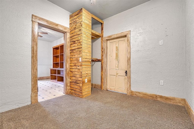 empty room with light carpet and ceiling fan