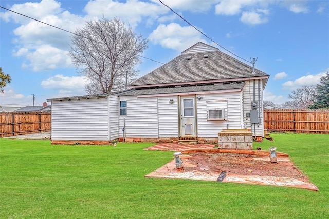 back of property featuring a yard