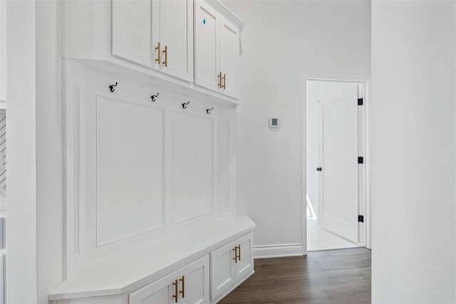 mudroom with dark hardwood / wood-style floors