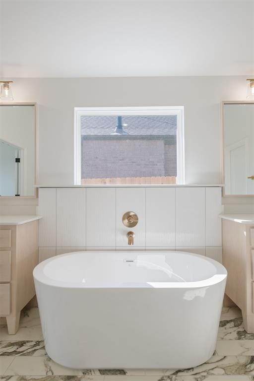 bathroom featuring a bathing tub and vanity