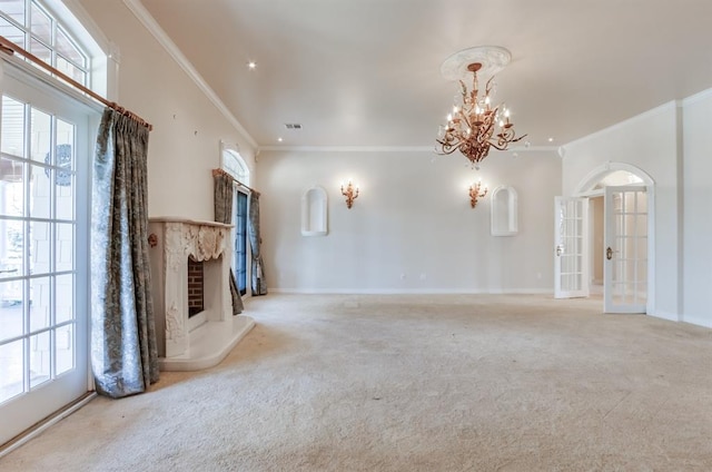 unfurnished living room featuring crown molding, light colored carpet, and a healthy amount of sunlight