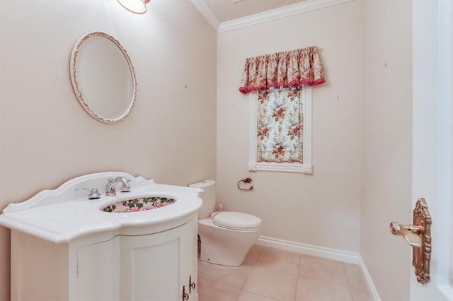 bathroom featuring tile patterned floors, toilet, vanity, and ornamental molding