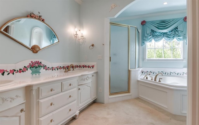 bathroom with crown molding, vanity, and shower with separate bathtub