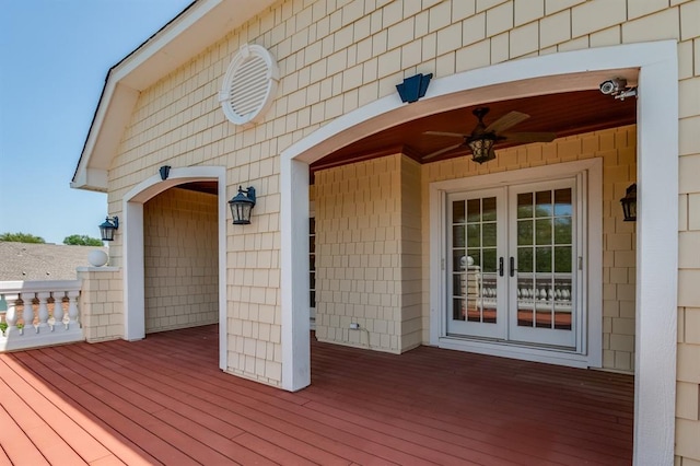 wooden terrace with french doors and ceiling fan