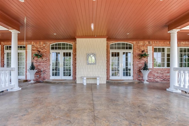 view of patio with covered porch and french doors