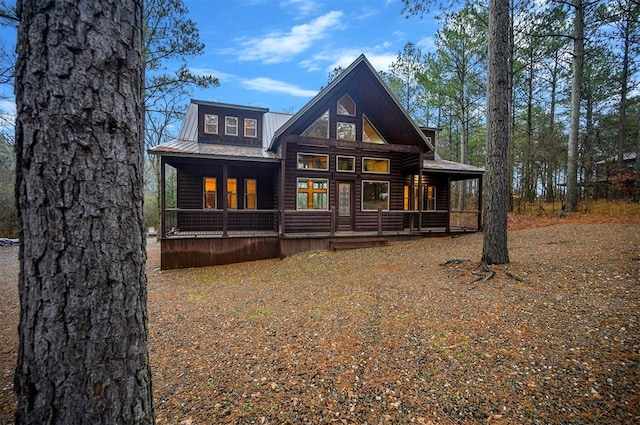 rear view of house with a porch