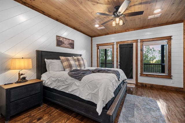 bedroom with wood ceiling, wood walls, ceiling fan, access to exterior, and dark hardwood / wood-style flooring