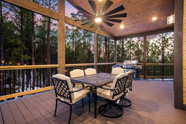 sunroom / solarium featuring ceiling fan, wood ceiling, and lofted ceiling