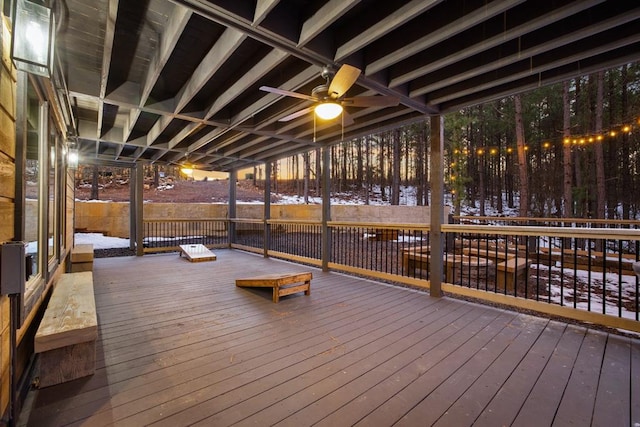 wooden deck featuring ceiling fan