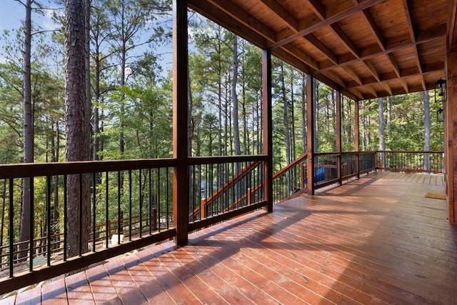 unfurnished sunroom with a wealth of natural light and wooden ceiling