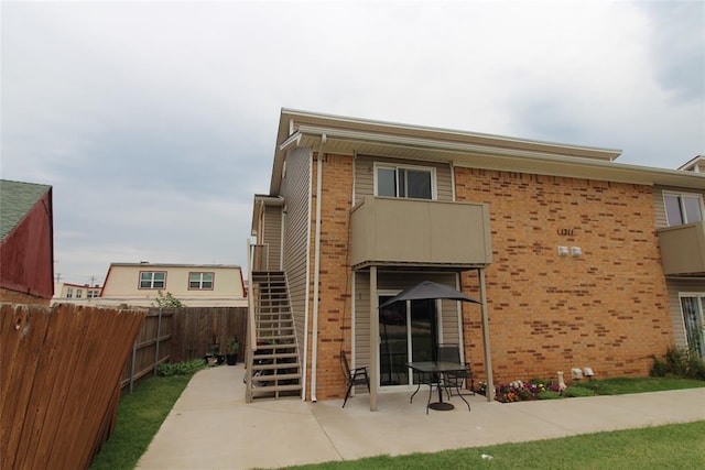 back of house with a patio