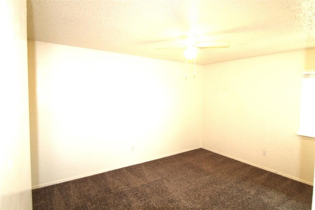 spare room with ceiling fan and carpet flooring