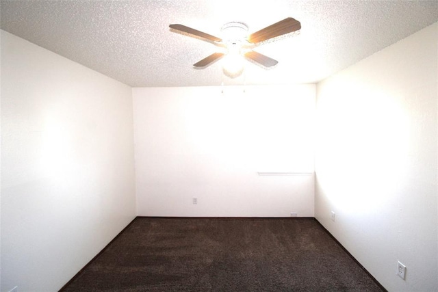 carpeted empty room featuring ceiling fan and a textured ceiling