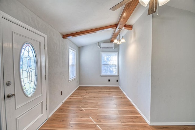 foyer entrance featuring vaulted ceiling with beams, light hardwood / wood-style floors, an AC wall unit, and ceiling fan