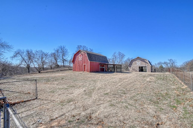 view of yard featuring an outbuilding and a rural view