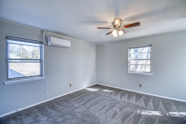 empty room with a wall mounted AC, ceiling fan, carpet floors, and a healthy amount of sunlight