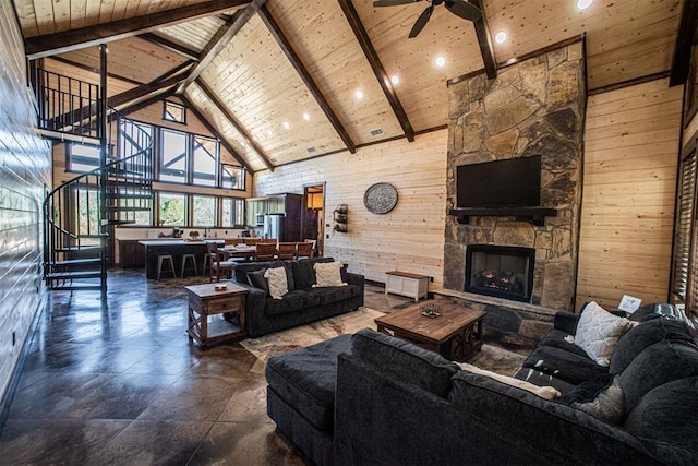 living room with a fireplace, high vaulted ceiling, wooden walls, and wooden ceiling