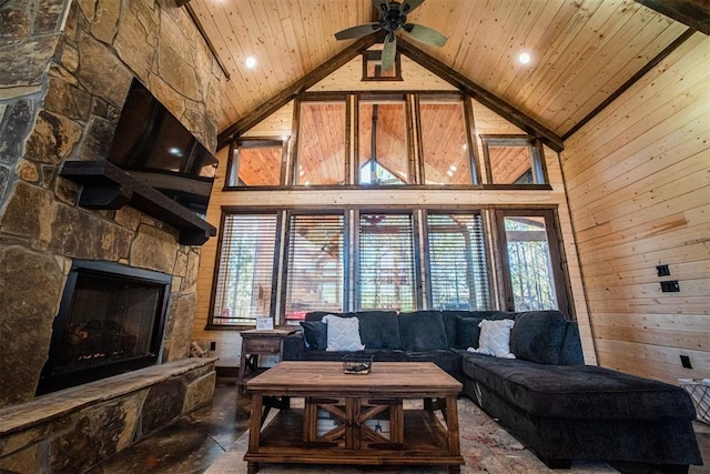 living room featuring a fireplace, high vaulted ceiling, wood walls, and wood ceiling