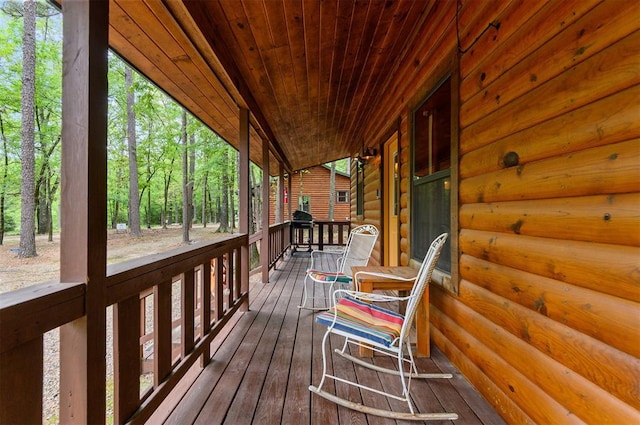 wooden terrace featuring a porch