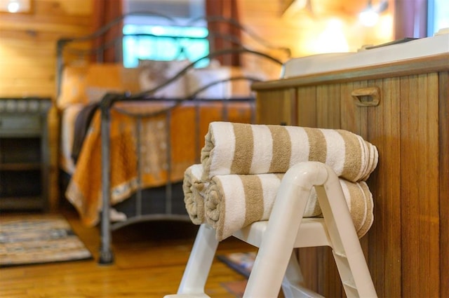 details featuring wooden walls and wood-type flooring