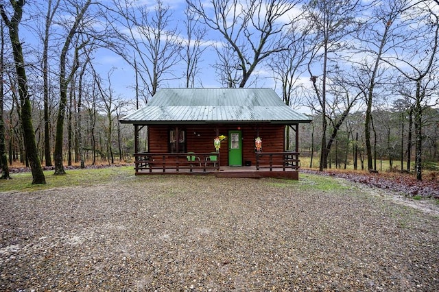 log cabin featuring a porch