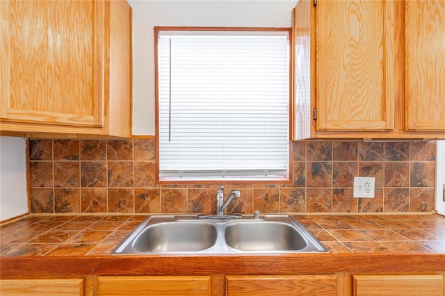 kitchen featuring decorative backsplash and sink